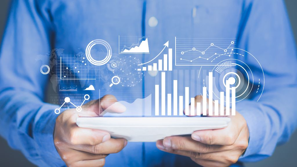 Ai-driven marketing dashboard with predictive analytics, analysts reviewing campaign metrics and graphs in futuristic agency setting